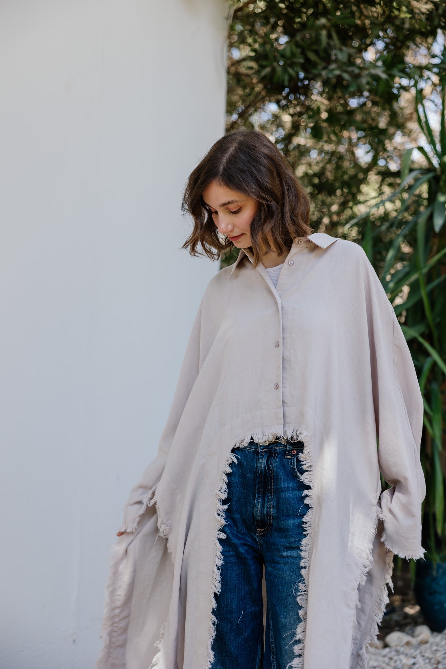 Fringed out cape in Beige