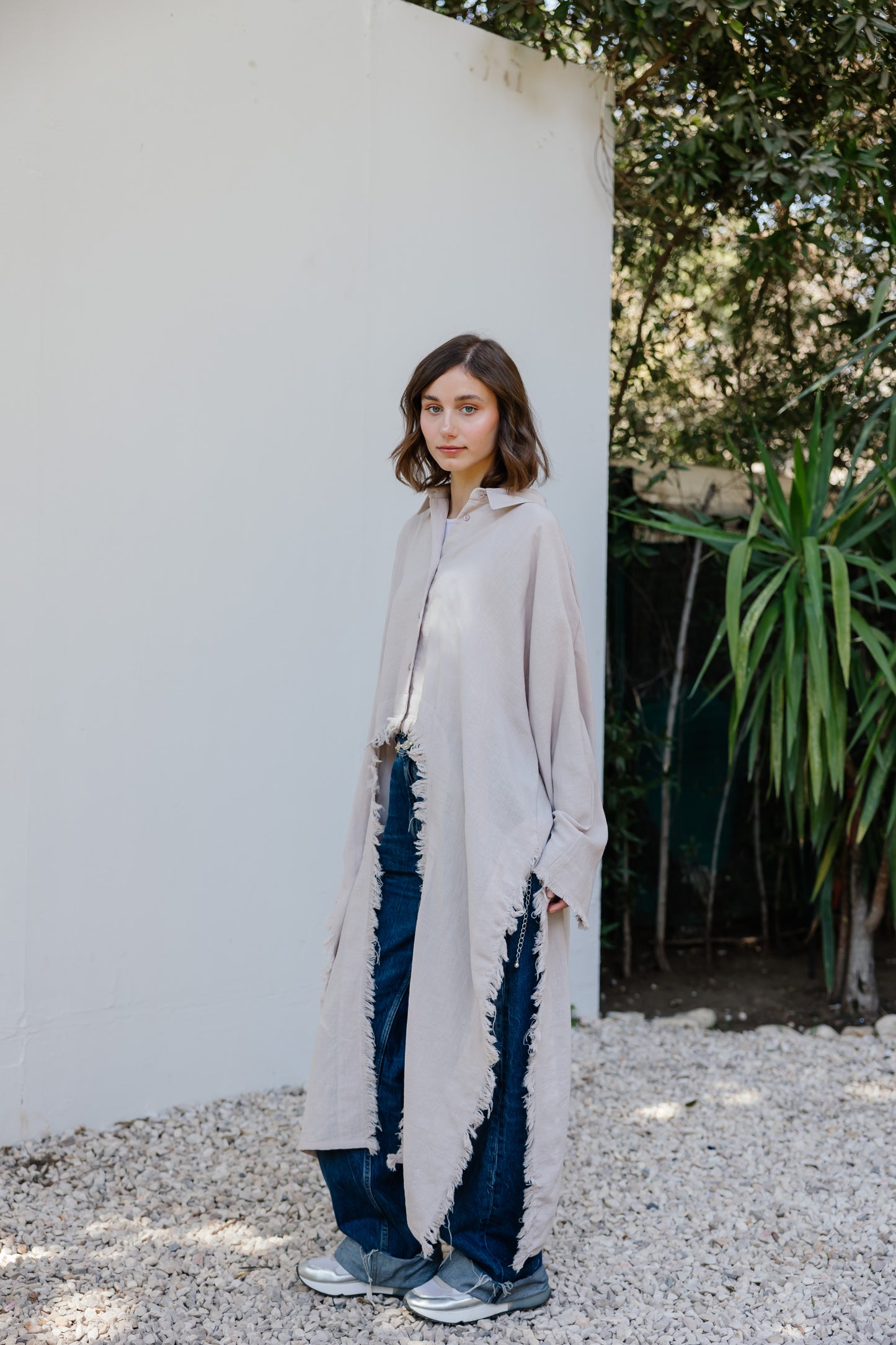 Fringed out cape in Beige