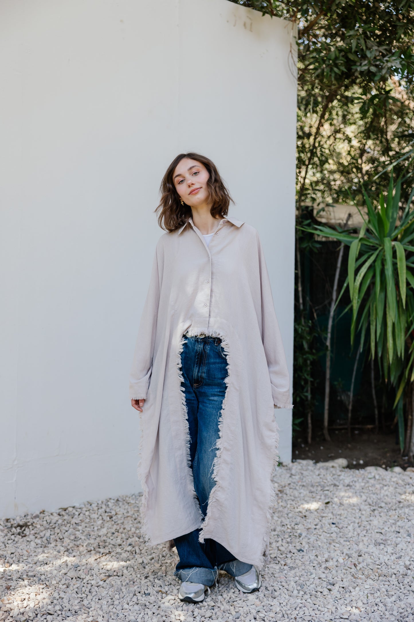 Fringed out cape in Beige