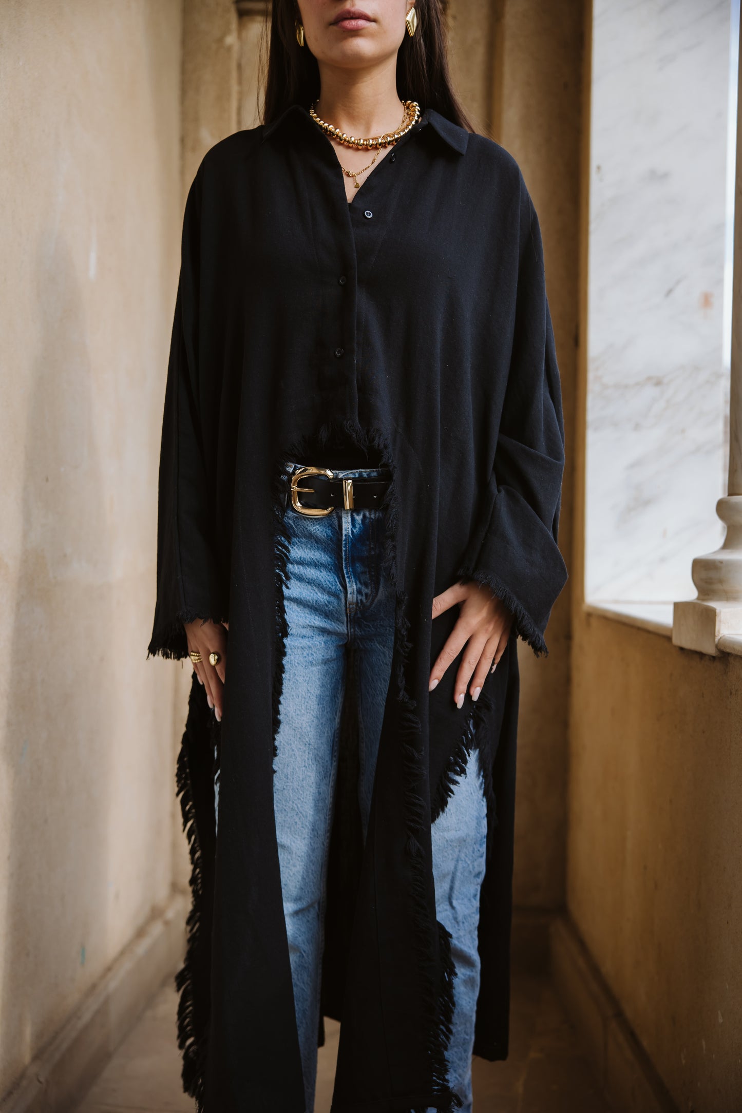 Fringed out cape in black