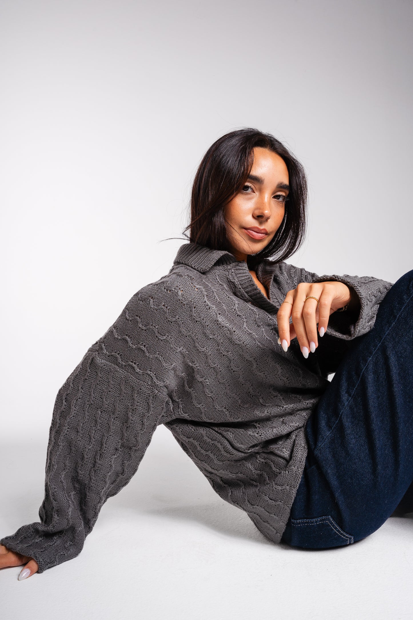 Going Places Pullover In Dark Grey