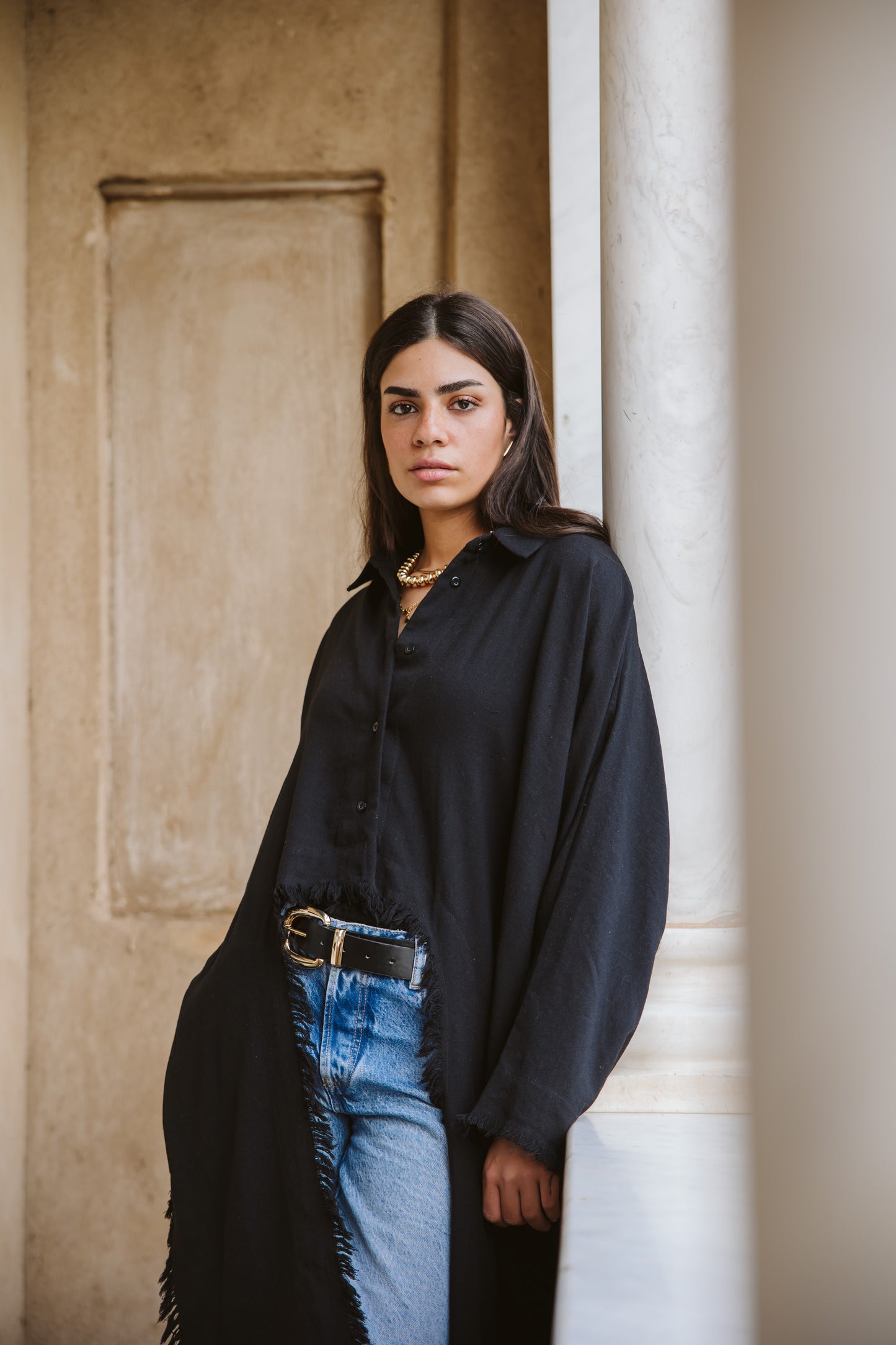 Fringed out cape in black