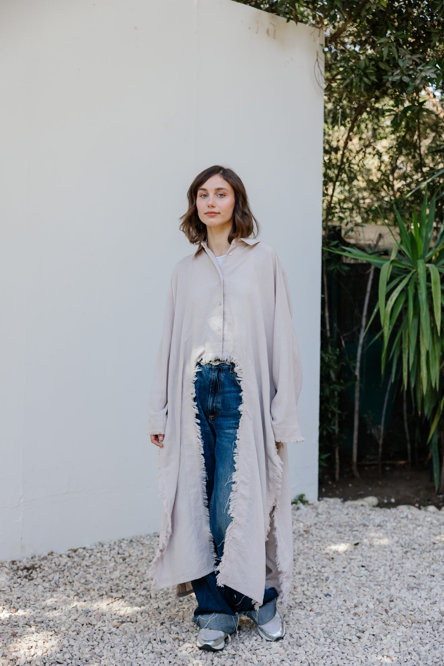 Fringed out cape in Beige