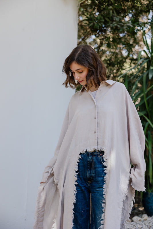 Fringed out cape in Beige