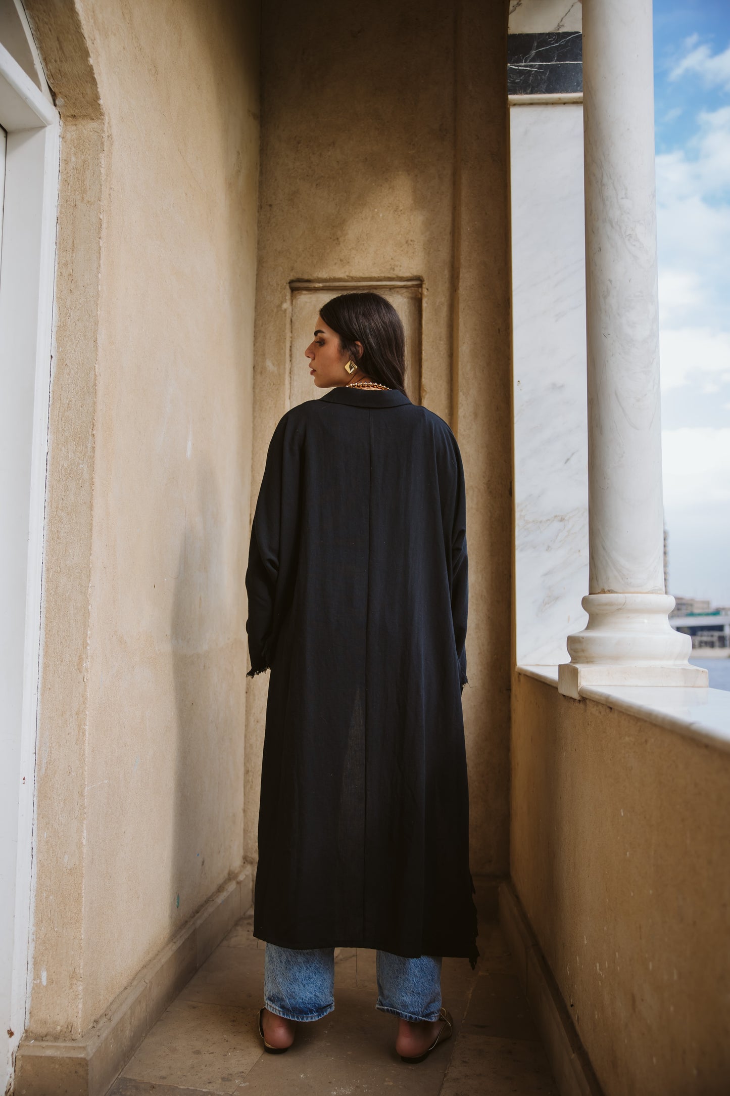 Fringed out cape in black