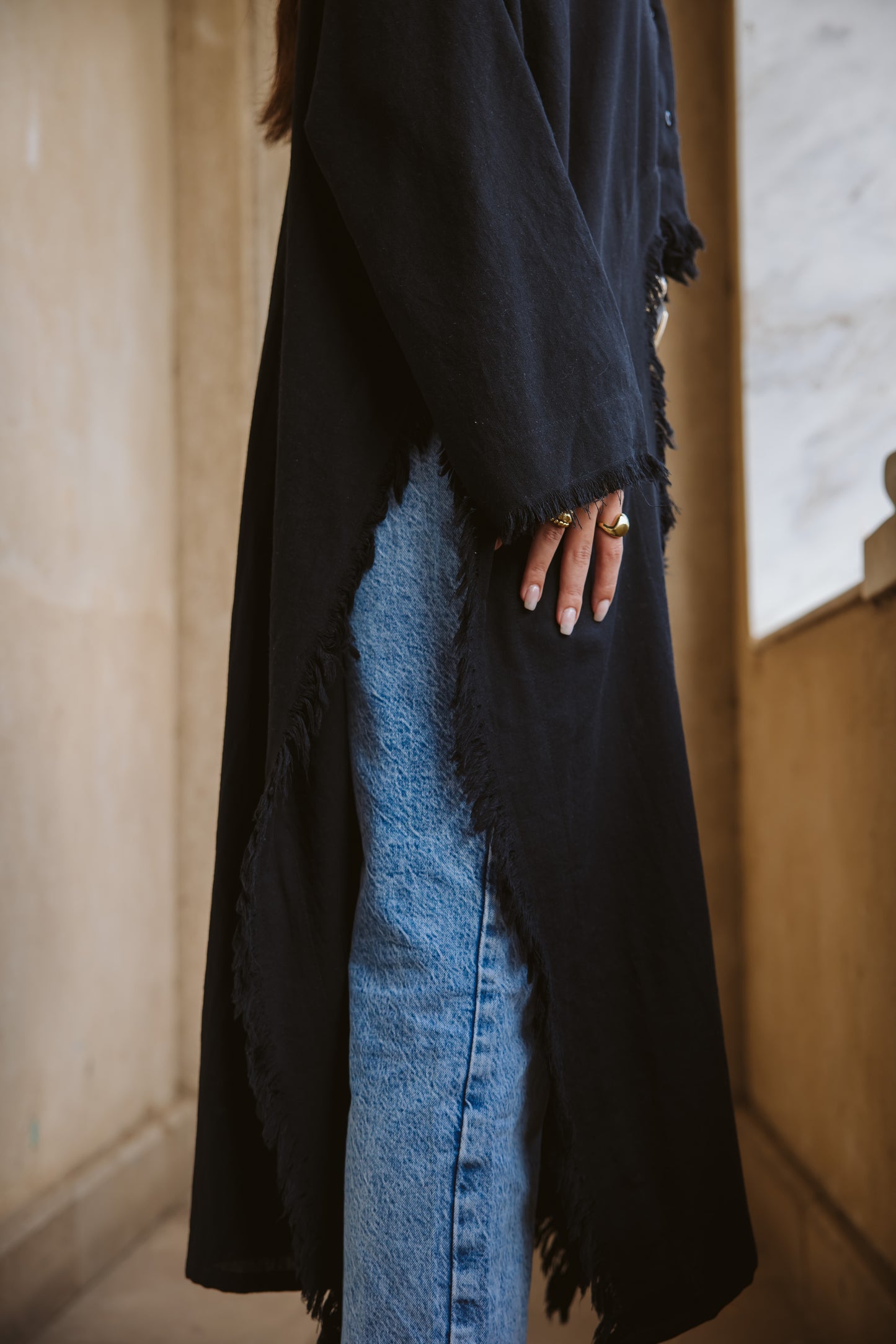Fringed out cape in black