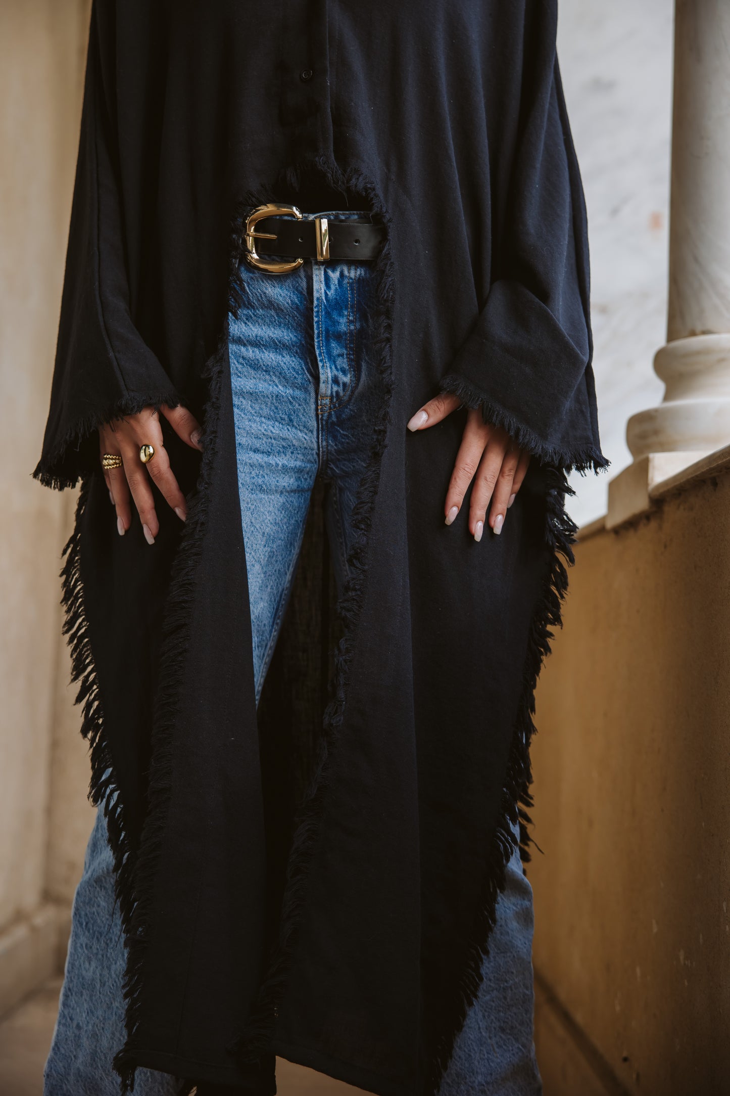 Fringed out cape in black
