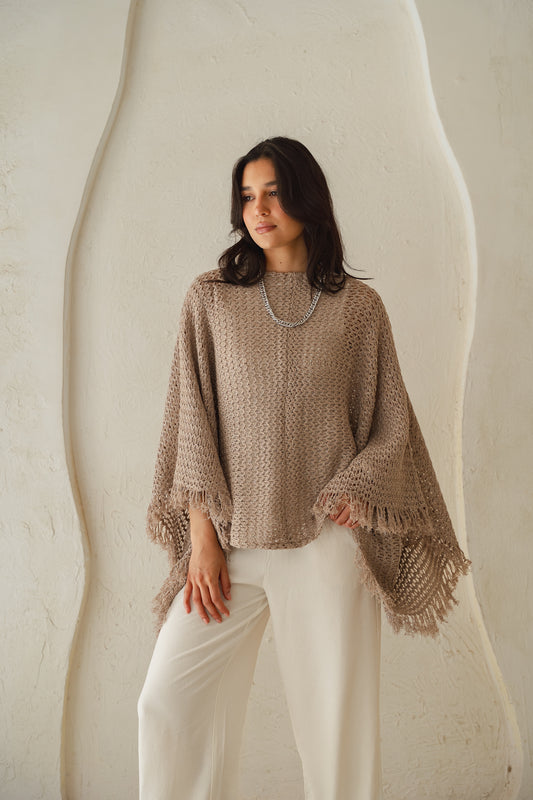 The crochet cape in Shimmer Taupe