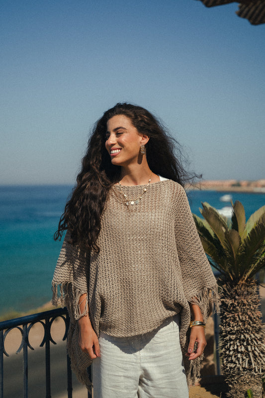The crochet cape in Taupe